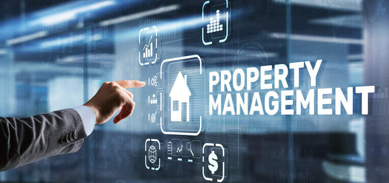 Image of hand pointing to interactive screen with wording 'Property Management'